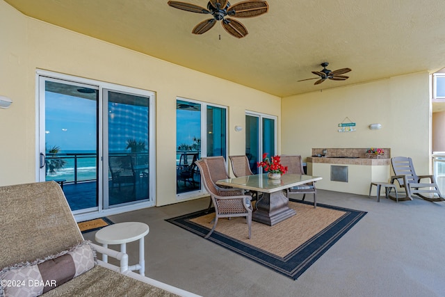 view of patio featuring ceiling fan