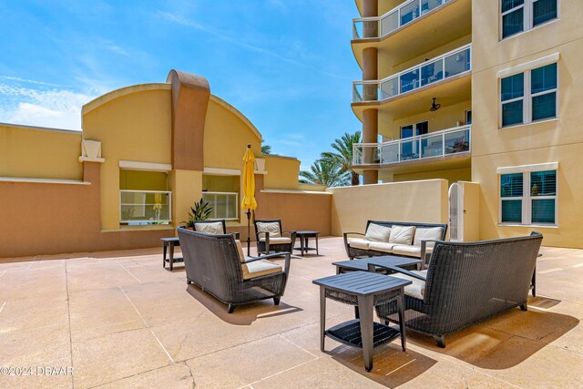 1925 S Atlantic Ave Unit 205, Daytona Beach Shores, FL 32118 - view of patio / terrace with outdoor lounge area
