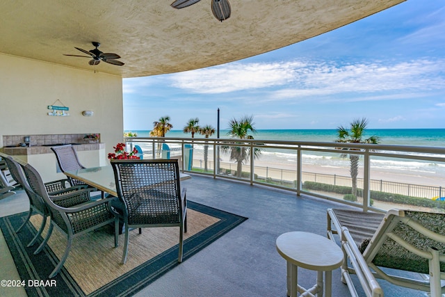 1925 S Atlantic Ave Unit 205, Daytona Beach Shores, FL 32118 - balcony featuring ceiling fan, view of water and beach, and outdoor dining space