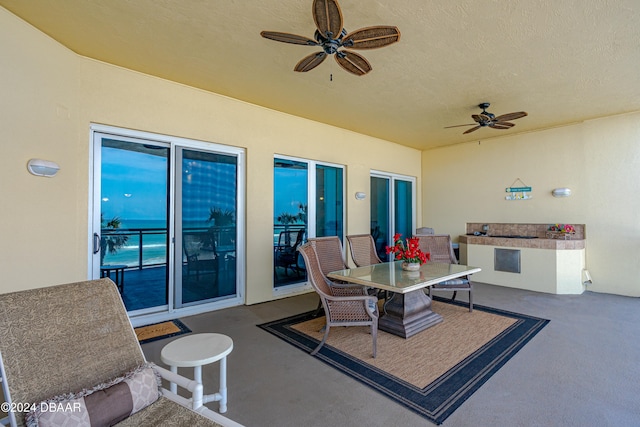 view of patio / terrace featuring ceiling fan