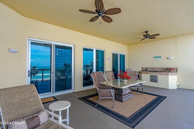 1925 S Atlantic Ave Unit 205, Daytona Beach Shores, FL 32118 - view of patio with ceiling fan and outdoor dining space