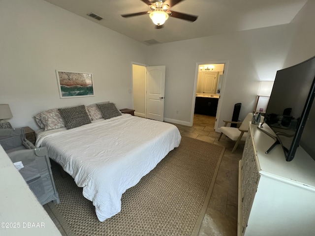 bedroom with tile patterned floors, ceiling fan, and ensuite bath