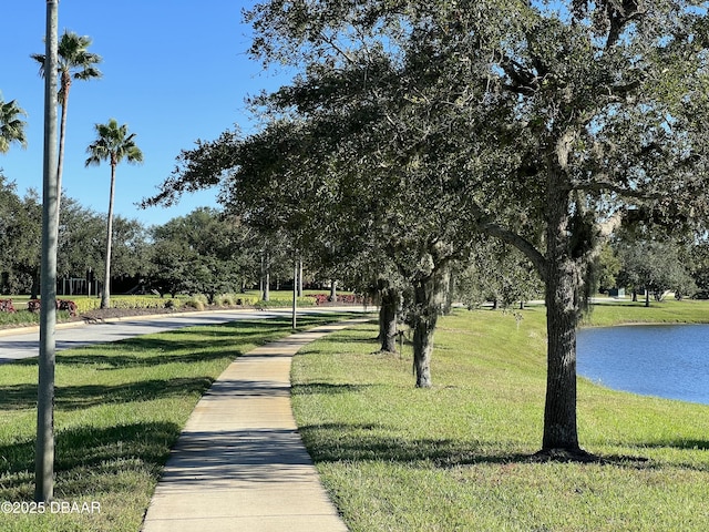 view of home's community with a lawn