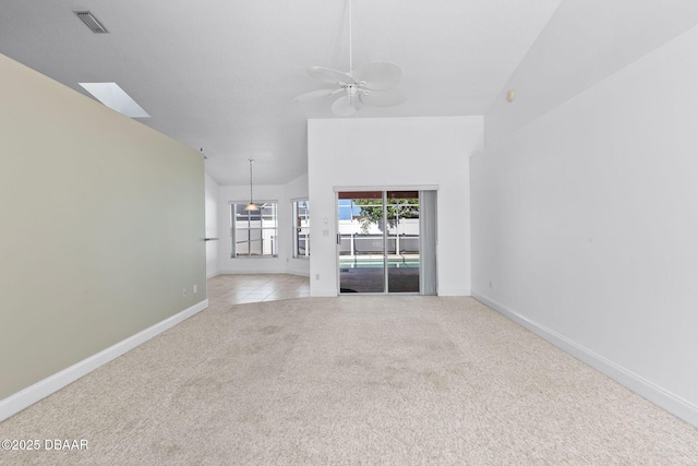 7 Sea Park Ter, Ormond Beach, FL 32176 - empty room with visible vents, baseboards, ceiling fan, vaulted ceiling, and light colored carpet