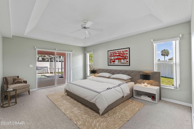 7 Sea Park Ter, Ormond Beach, FL 32176 - bedroom with carpet, access to exterior, baseboards, and a raised ceiling