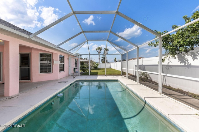 7 Sea Park Ter, Ormond Beach, FL 32176 - view of swimming pool with a patio, a fenced in pool, fence, and glass enclosure