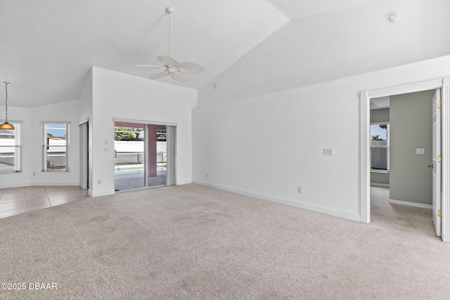 7 Sea Park Ter, Ormond Beach, FL 32176 - unfurnished living room featuring light carpet, high vaulted ceiling, baseboards, and ceiling fan