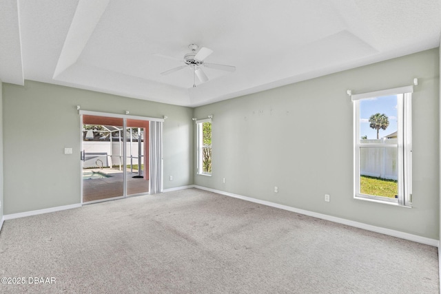 7 Sea Park Ter, Ormond Beach, FL 32176 - carpeted empty room with ceiling fan, baseboards, and a raised ceiling