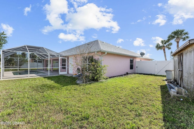 7 Sea Park Ter, Ormond Beach, FL 32176 - back of property featuring stucco siding, a fenced backyard, a gate, and a lawn