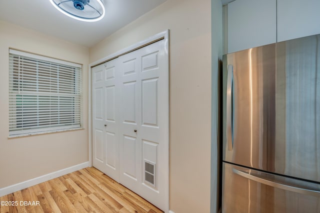 66 Rivers Edge Ln Unit 66, Palm Coast, FL 32137 - kitchen featuring freestanding refrigerator and light wood-style floors