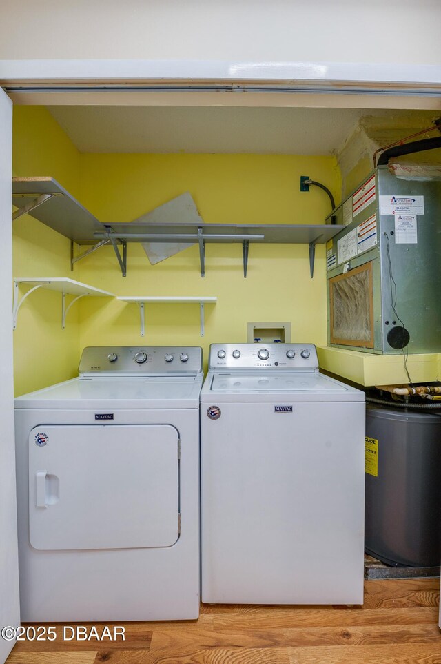 66 Rivers Edge Ln Unit 66, Palm Coast, FL 32137 - washroom with washer and dryer and light wood-style flooring