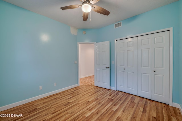 66 Rivers Edge Ln Unit 66, Palm Coast, FL 32137 - unfurnished bedroom featuring wood finished floors, a closet, and ceiling fan