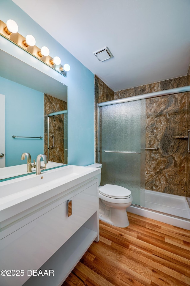 66 Rivers Edge Ln Unit 66, Palm Coast, FL 32137 - full bathroom featuring vanity, wood finished floors, and a stall shower
