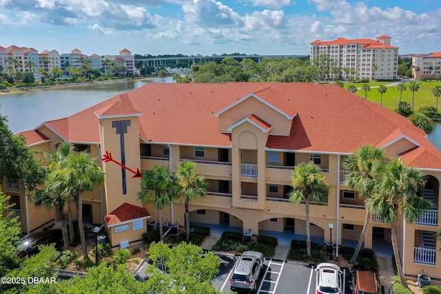 66 Rivers Edge Ln Unit 66, Palm Coast, FL 32137 - view of apartment building / complex with uncovered parking and a water view