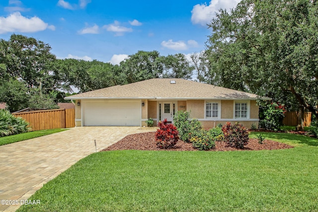 single story home with a front yard and a garage