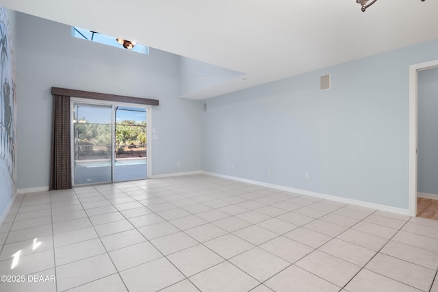 spare room with light tile patterned floors