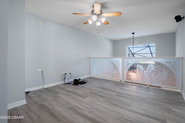 spare room featuring light hardwood / wood-style flooring and ceiling fan