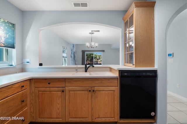 kitchen featuring sink, light tile patterned floors, a chandelier, and black dishwasher