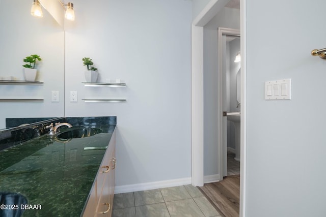 bathroom with tile patterned flooring and vanity