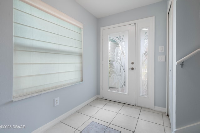 tiled entryway featuring a wealth of natural light