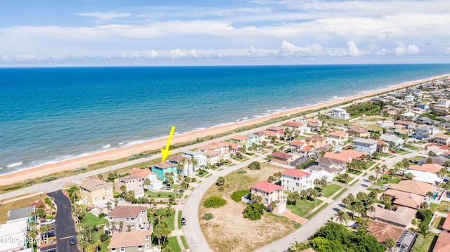 drone / aerial view with a view of the beach and a water view