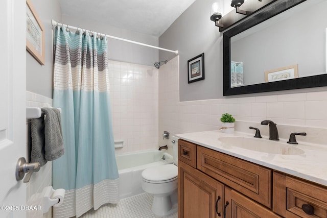 full bathroom featuring shower / bath combination with curtain, tile patterned flooring, toilet, vanity, and tile walls