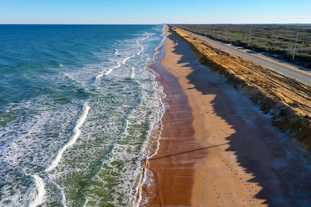 bird's eye view featuring a beach view and a water view