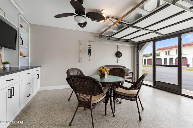 dining space with ceiling fan