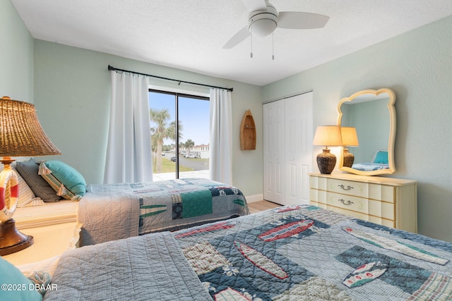 bedroom featuring access to exterior, a closet, ceiling fan, and a textured ceiling