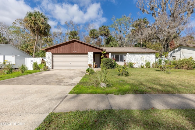 ranch-style home with a garage and a front yard