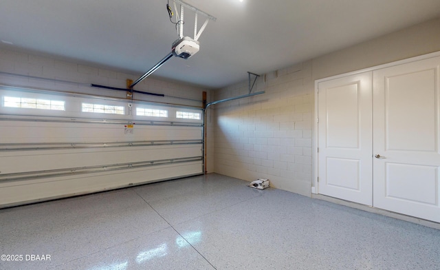 garage featuring a garage door opener