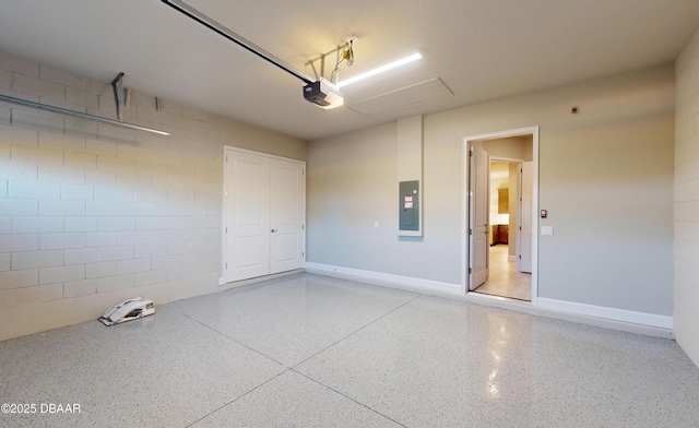 garage featuring a garage door opener and electric panel