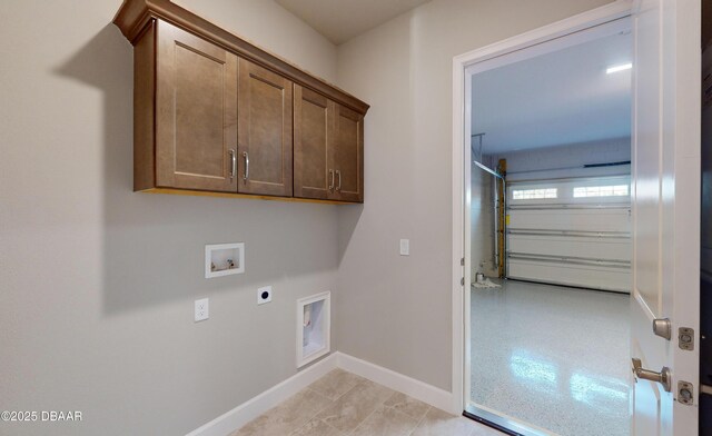 clothes washing area with electric dryer hookup, hookup for a washing machine, and cabinets