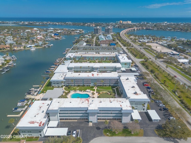 birds eye view of property featuring a water view