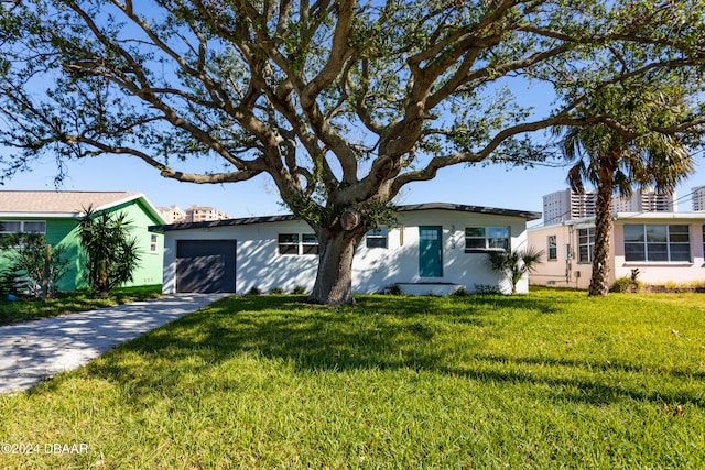 ranch-style house with a front lawn and a garage