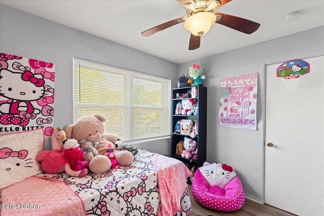 bedroom featuring hardwood / wood-style flooring and ceiling fan