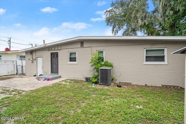 856 Essex Rd, Daytona Beach, FL 32117 - back of property with cooling unit and a patio