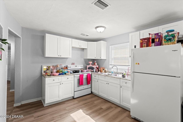 kitchen with white cabinetry, light stone countertops, sink, light hardwood / wood-style floors, and white appliances