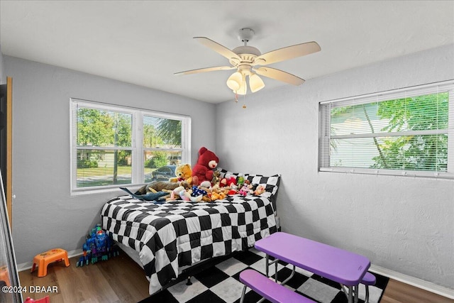 856 Essex Rd, Daytona Beach, FL 32117 - bedroom featuring wood finished floors, baseboards, ceiling fan, and a textured wall