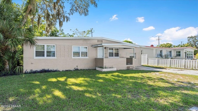 view of front of home with a front yard