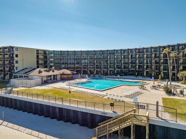 view of swimming pool with a patio area