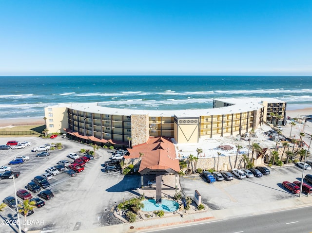 aerial view featuring a view of the beach and a water view