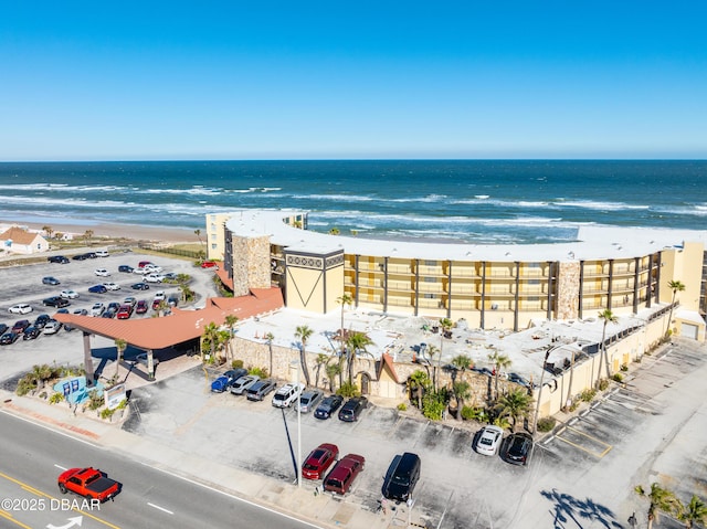 drone / aerial view with a view of the beach and a water view