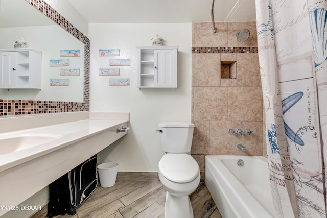 bathroom with toilet and shower / bath combo