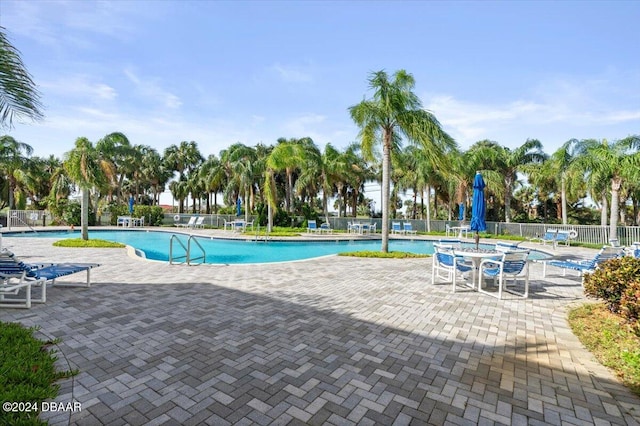 view of swimming pool with a patio area