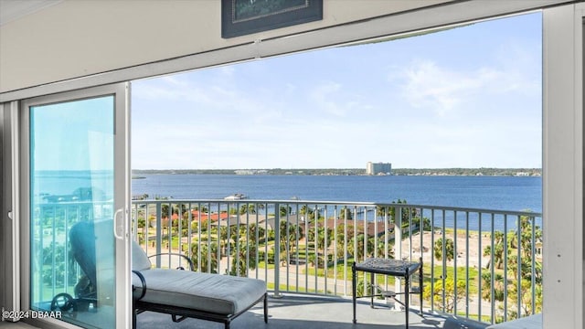 balcony featuring a water view