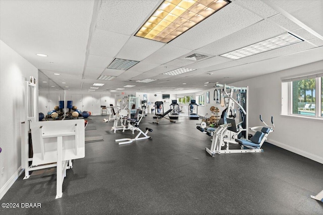 workout area with a paneled ceiling