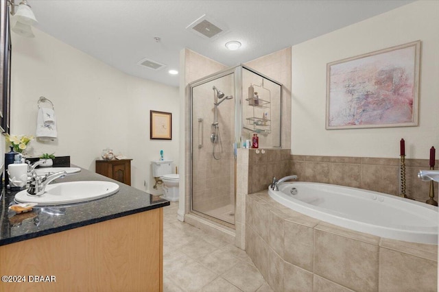 full bathroom with toilet, vanity, tile patterned flooring, and separate shower and tub