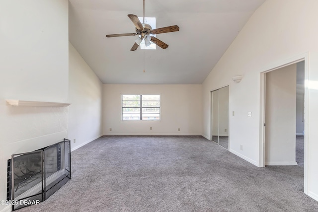 unfurnished living room featuring baseboards, ceiling fan, carpet, a fireplace, and high vaulted ceiling