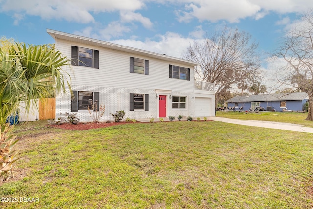 view of front of house with concrete driveway, brick siding, a front yard, and fence